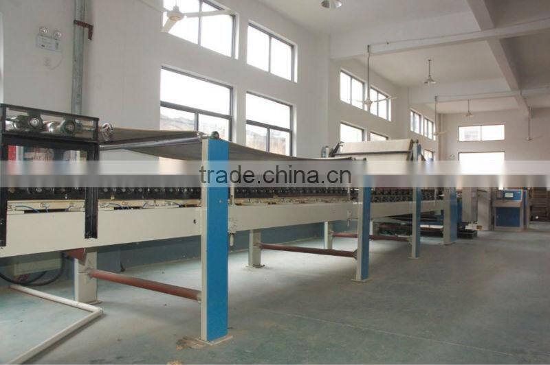 Automatic corrugated cardboard manufacturing machine