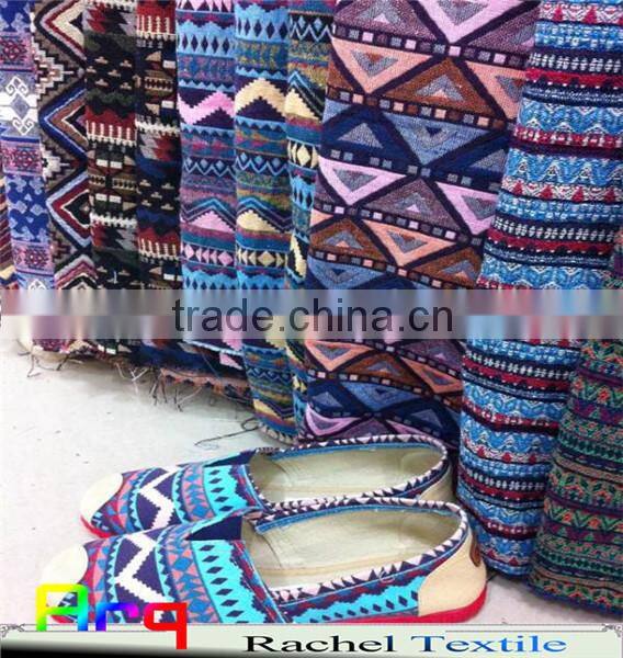 Multi colored fabric with many bright color, stripe design using for home textile or garments