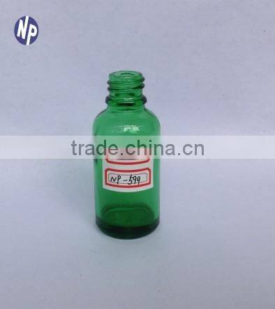 green essential oil glass bottle with dropper