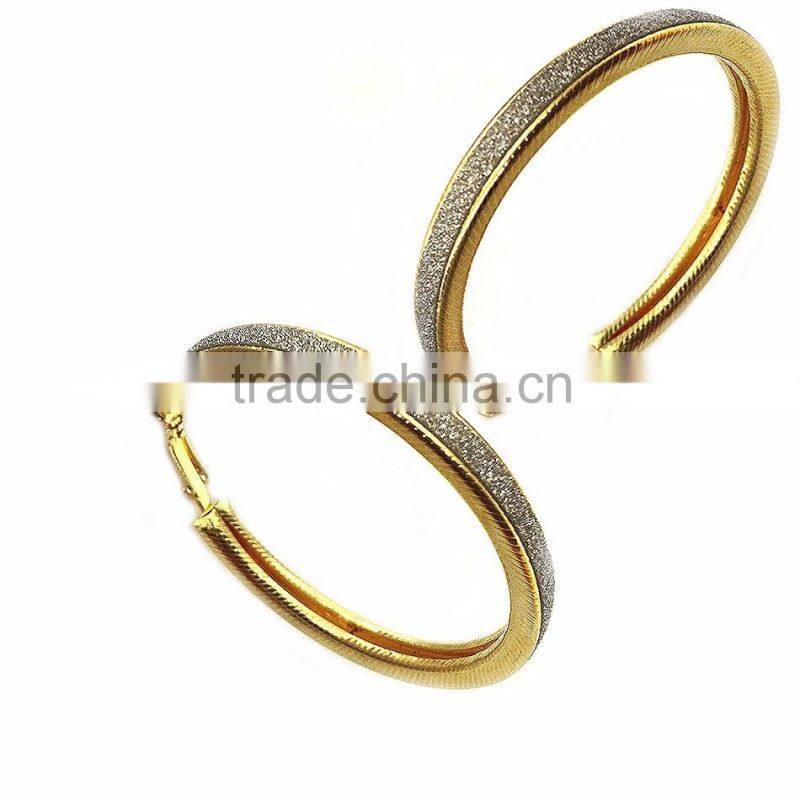 18k gold plated hoop design adorned with strips of crystal dust earring
