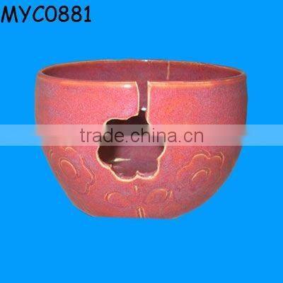 Ceramic pink bowl as yarn closet organizer