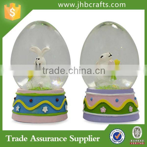 Set of Egg Shaped Easter Bunny Rabbits Snow Globe