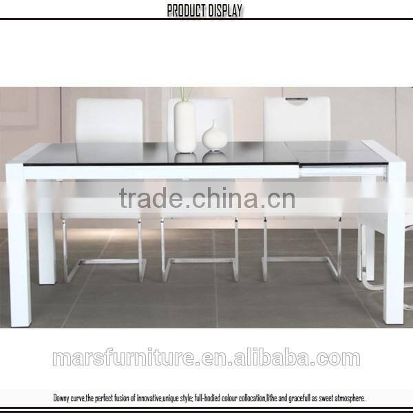 White extendable glass dining table