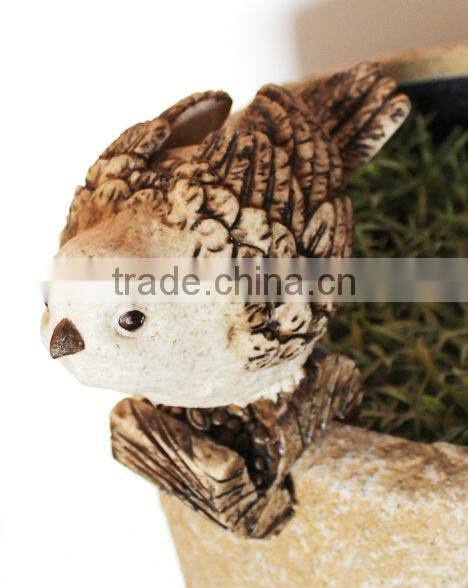 Bird standing on a base pot hanger outdoor birds sculpture