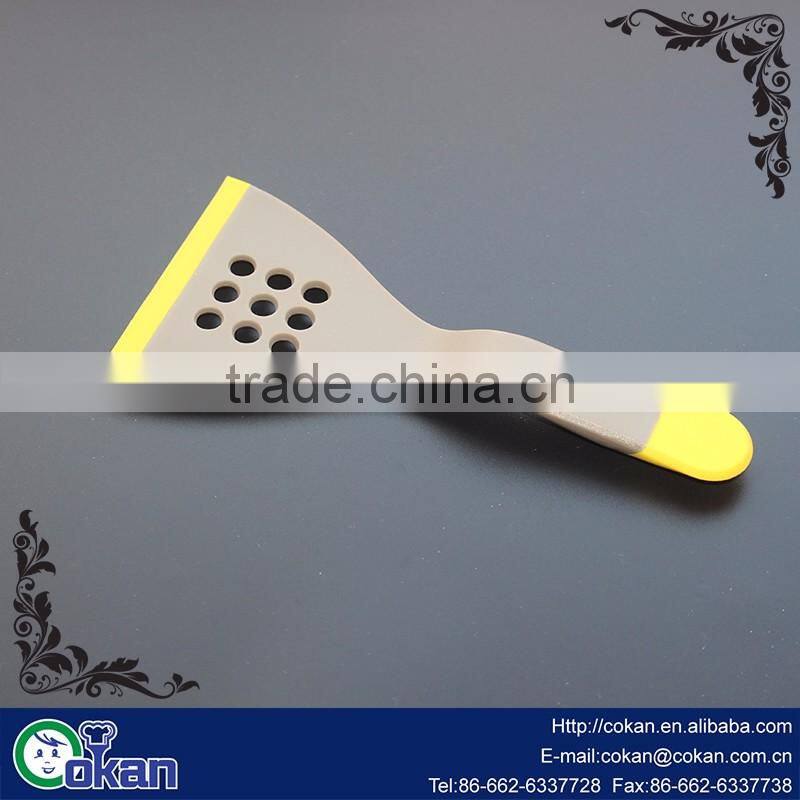 COKAN Nylon slotted turner covered TPR Multi