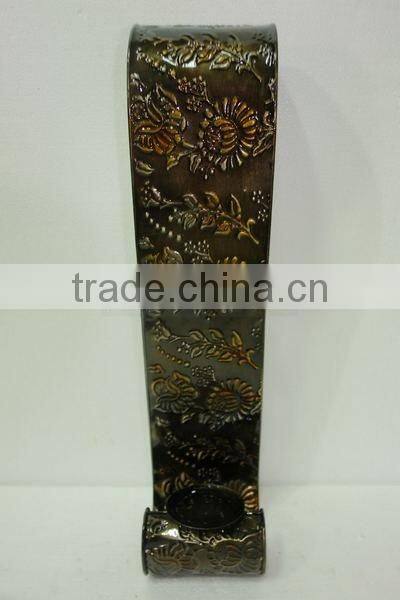 Wall- mounted iron candle holder