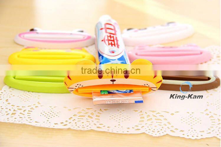 hot selling plastic toothpaste tube squeezer/toothpaste dispenser,wholesale custom children automatic toothpaste dispenser