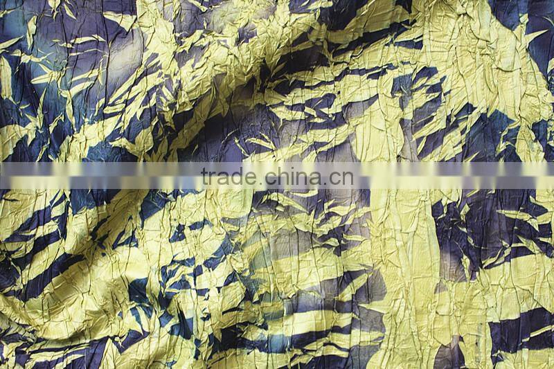 Do the old effect leaves pleated and printed polyester fabric in special style of garment fabric