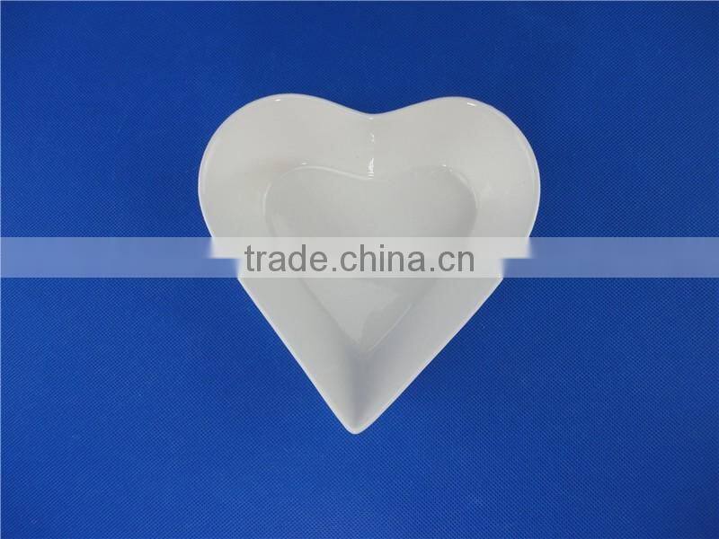 white ceramic heart shaped bowl