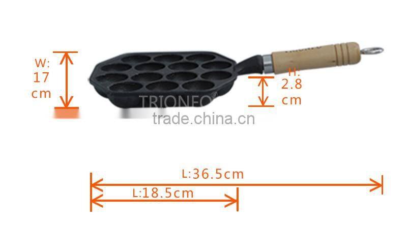 Mini cast iron takoyaki grill with wooden handle