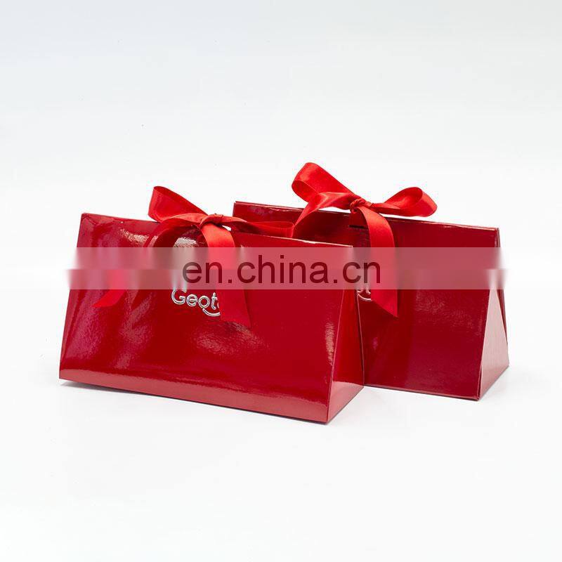 Custom brand logo printing creative red foldable triangle rigid cosmetic gift packaging box with ribbon bow