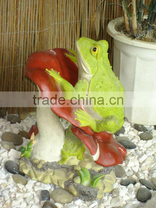 Animal decoration green frog on a red mushroom outdoor decor