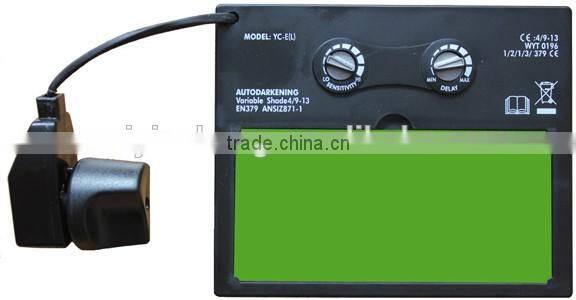 Auto-darkening welding helmet