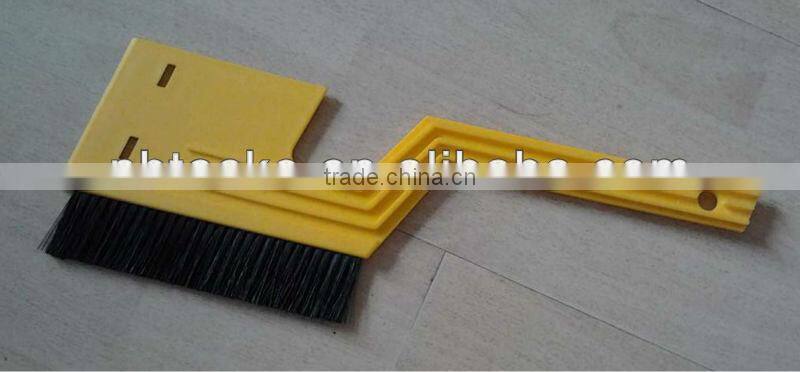 Ice scraper with brush