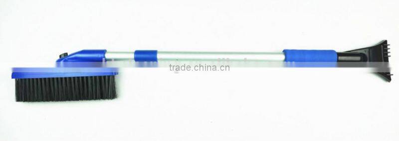 extendable rotating snow cleaning brush with scraper