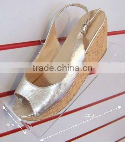 Lucite shoe shelf in suppermarket