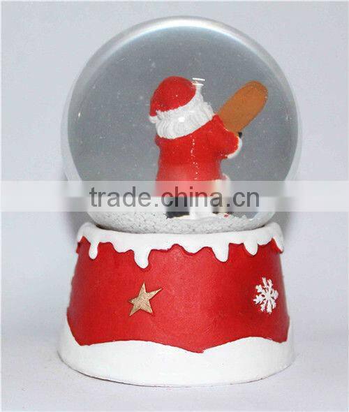 Resin santa snow globe with blowing snow