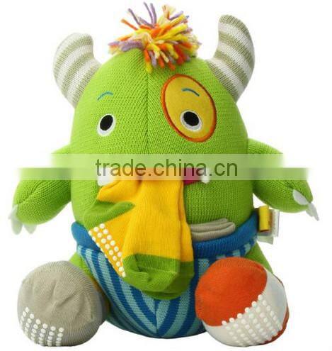 plush monster carrying baby knit socks toy/custom plush toy