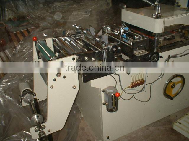 Woven material die cutting machine