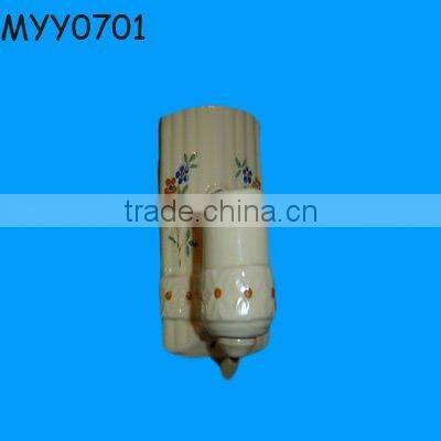 white ceramic human shape candle stand