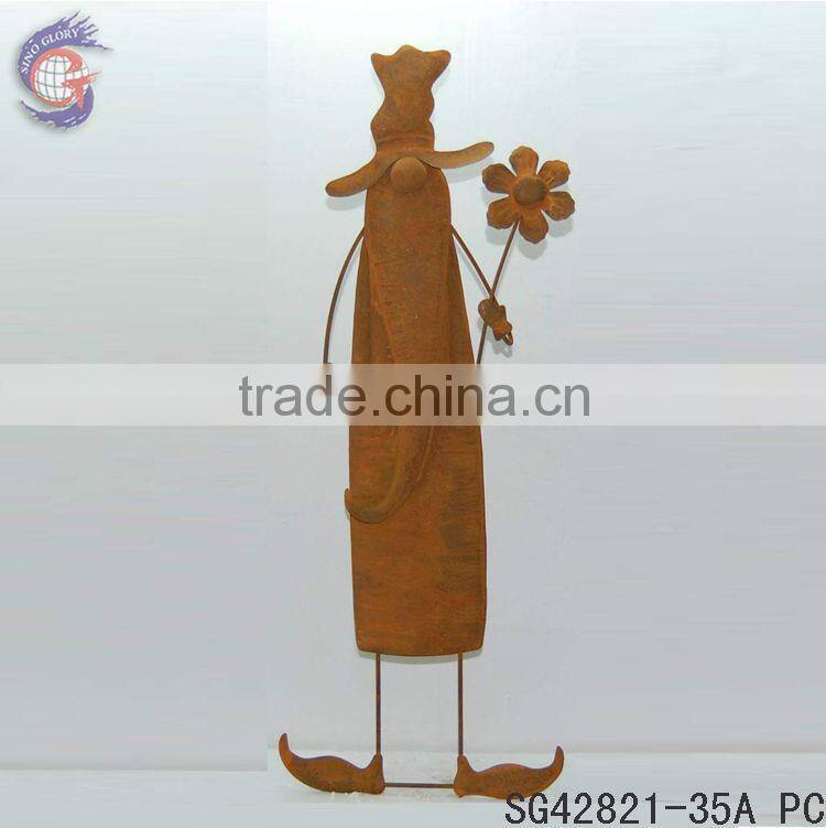rustic metal gnome holding flower ground stakes for garden decorations