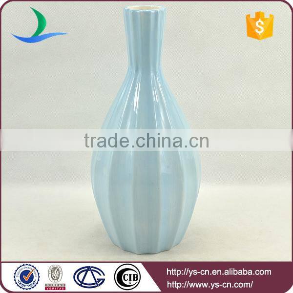 matt blue ceramic vase painted by hand for hotel decoration