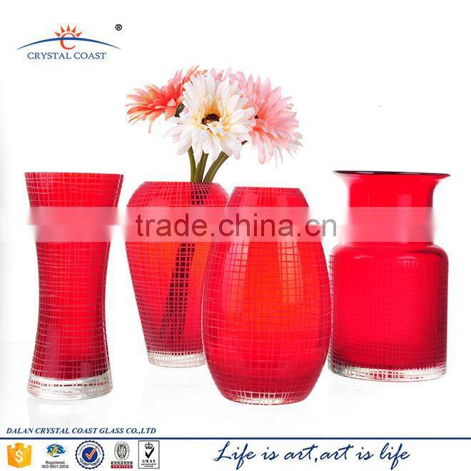 red stained flower shaped handblown colored glass vases