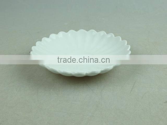 white porcelain flower-shaped dish
