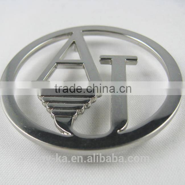 designer metal emblems handbag