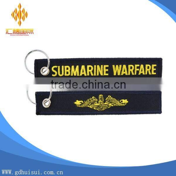 Popular design cheap customized elliptical shape embroidery personalized logo key chain