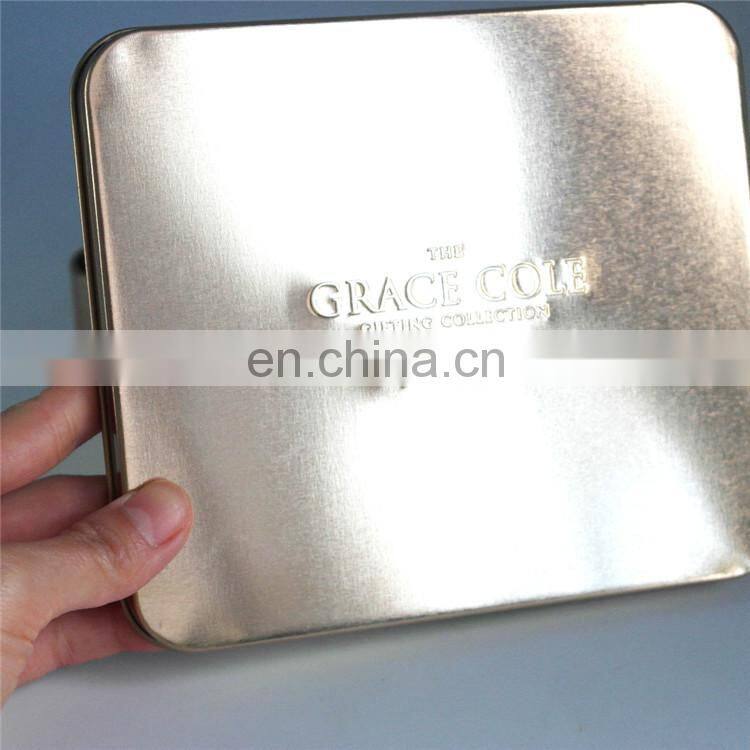 Gift tin box with purple color with ribbon hair bow