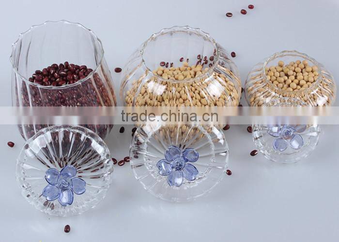 china hot sale factory fashionable design glass food container jar with flower shape lid painted blue