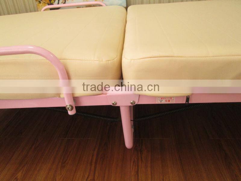 single pink folding metal bed