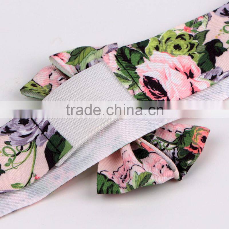 Red christmas ribbon bow with adhesive tape