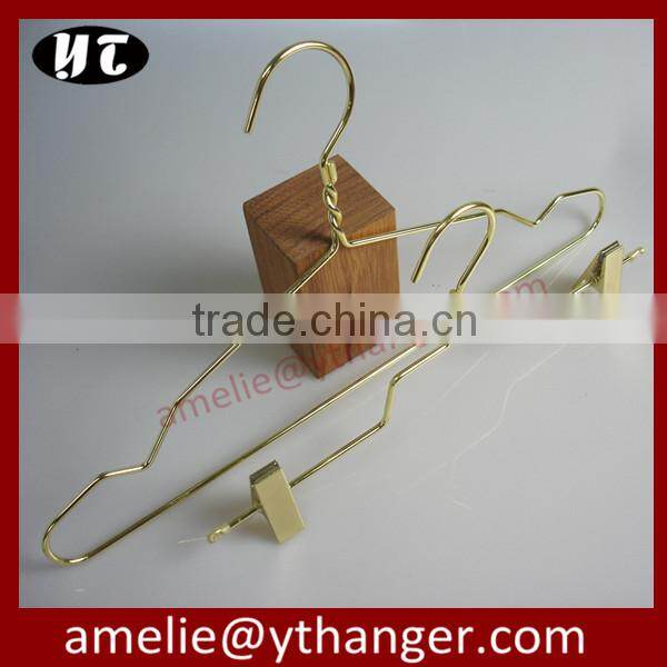 Gold wire coat hangers for luxury garment brand store use