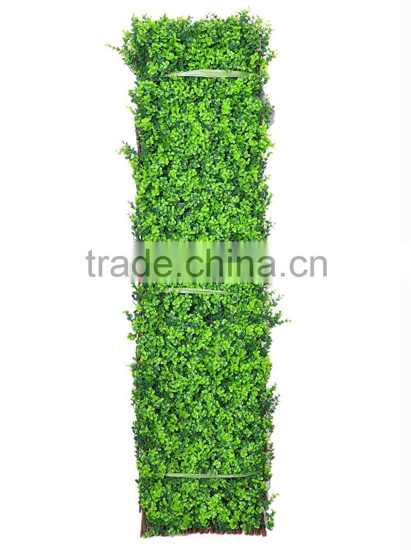 Garden trellis decorated with artificial plants