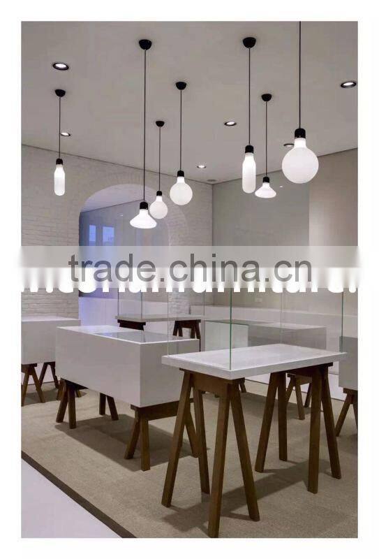 Hi Macs / Corian solid surface made center cashier desk for optical store design