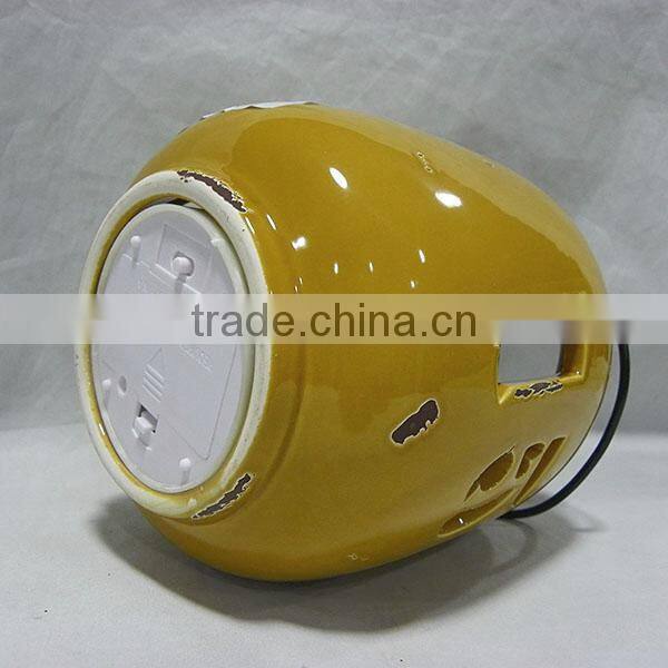 Yellowish brown ceramic storm lantern
