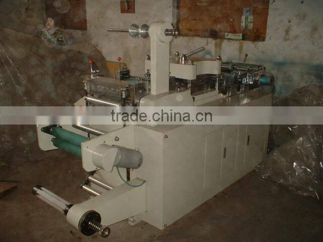 Woven material die cutting machine