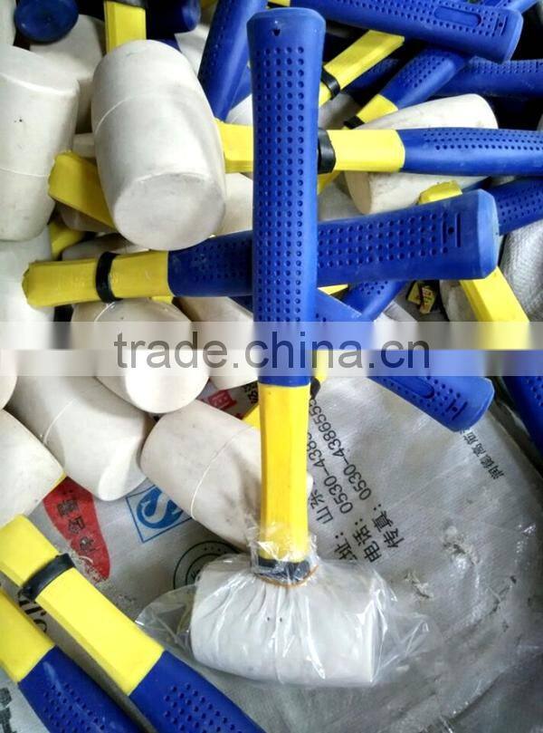 white colored rubber mallet hammer with wooden handle