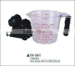 plastic measuring cup with spoons
