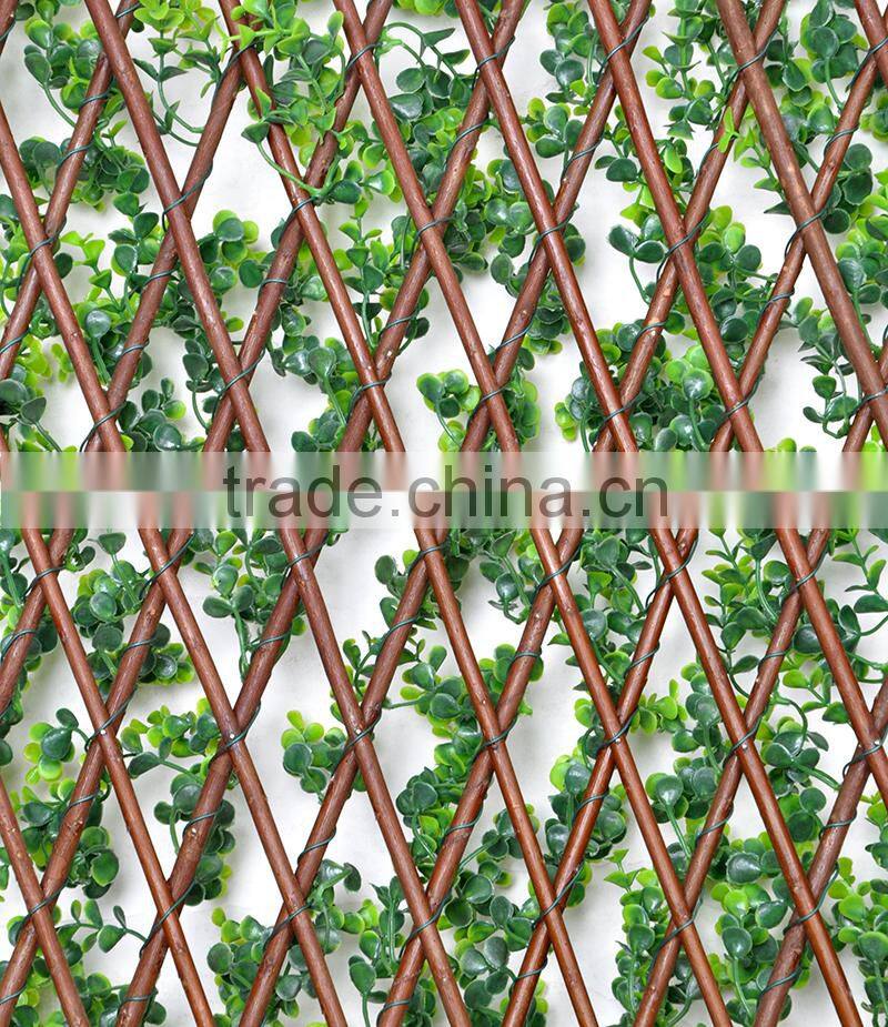 Garden trellis decorated with artificial plants
