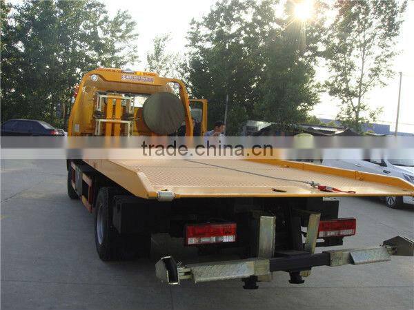 small flatbed towing truck