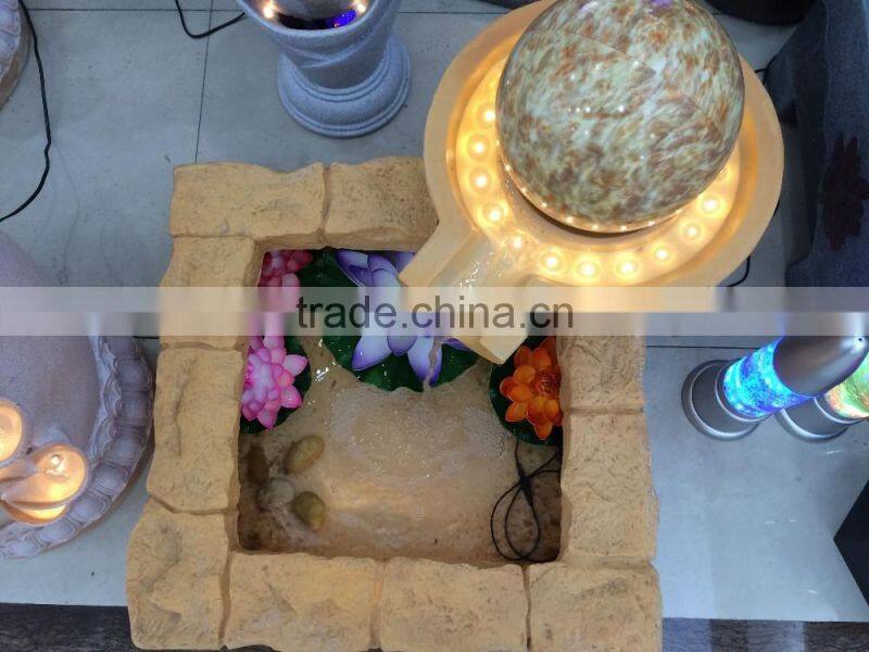 LED yellow light color resin and sandstone fountain with ball