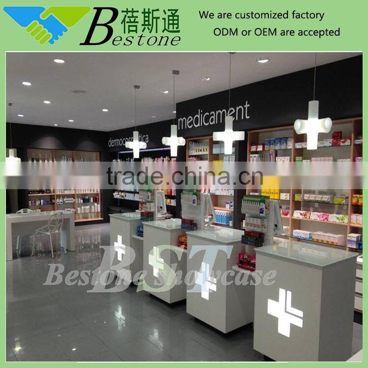 Retail pharmacy store interior design, gondola unit with LED pharmacy cross