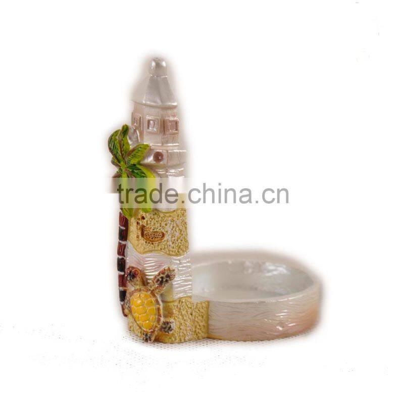 Candlestick with coconut tree and shell on lighthouse statue