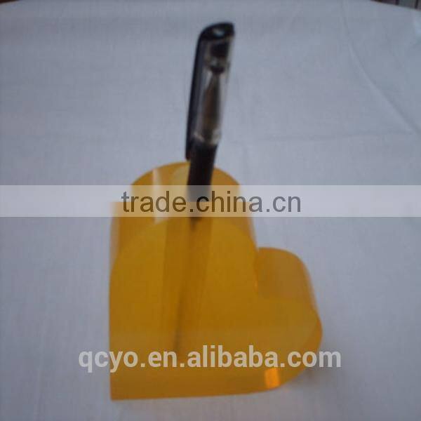 heart shaped office pen holder stand in table