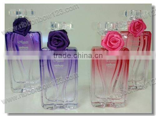 designs of ribbon flowers for perfume bottle