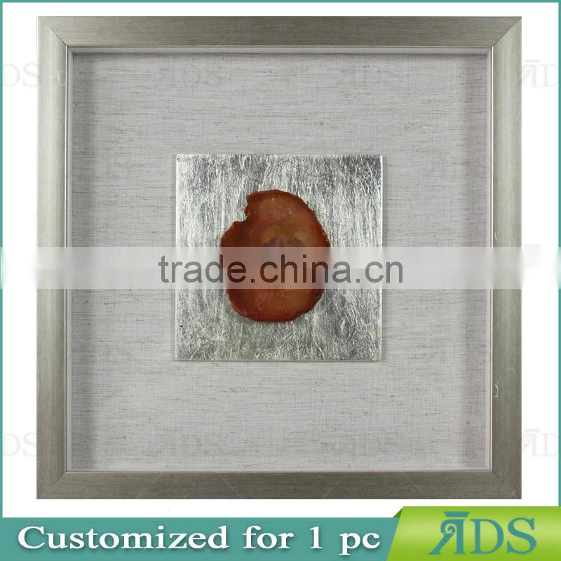 Box photo frames with mottled silver background encasing natural agate under glass