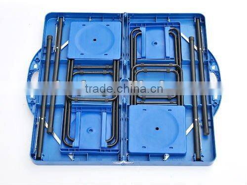 blue plastic camping table with 4 stools